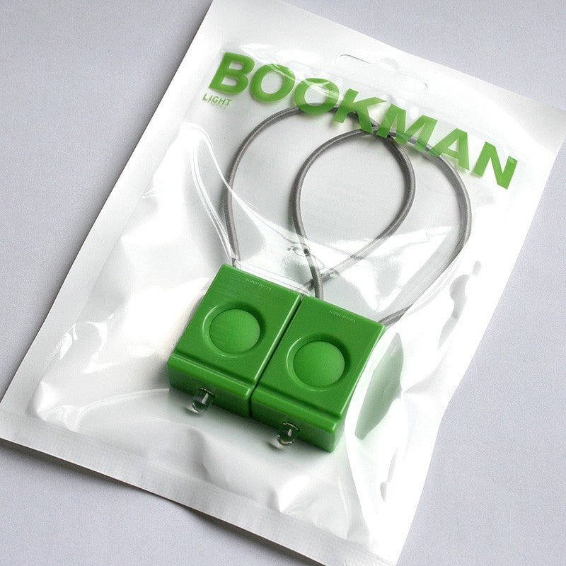 Pair of green Bookman bicycle lamps