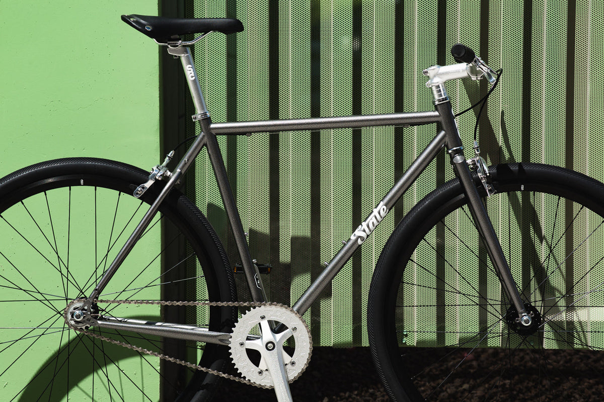 State Bicycle Co. 4130 Hammered Powder Coat fixed gear single-speed bike, side view
