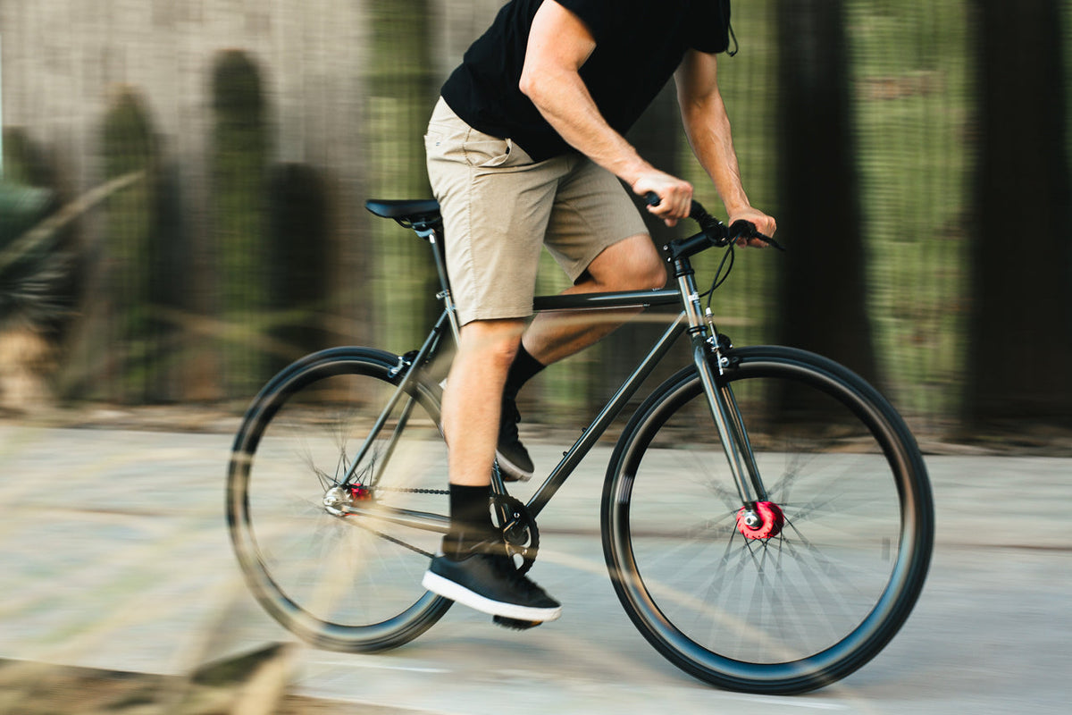 State Bicycle Co. Core-Line Earthstone grey-green city bike, lifestyle shot