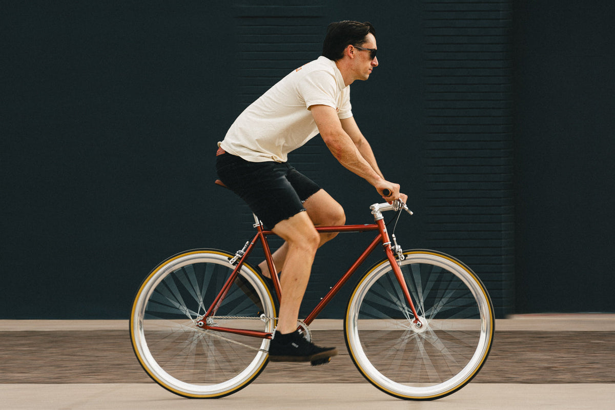State Bicycle Co. Core-Line Lucky Penny copper city bike, soft-focus lifestyle shot