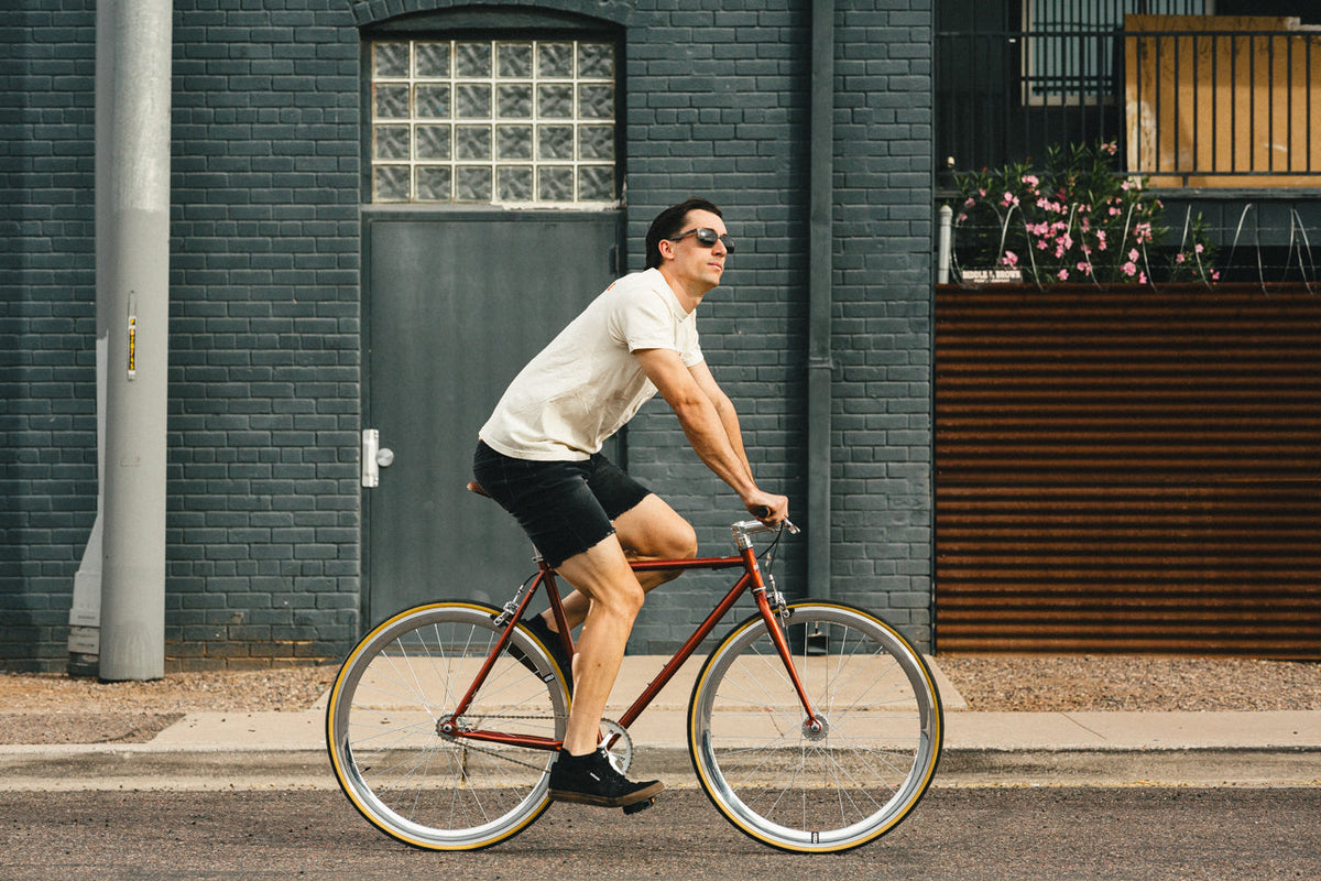 State Bicycle Co. Core-Line Lucky Penny copper city bike, full lifestyle shot