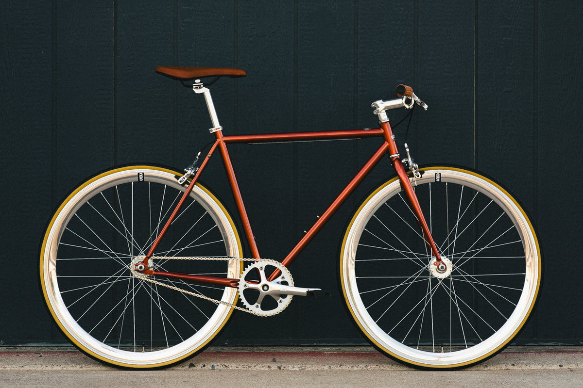 State Bicycle Co. Core-Line Lucky Penny copper city bike, full side lifestyle shot