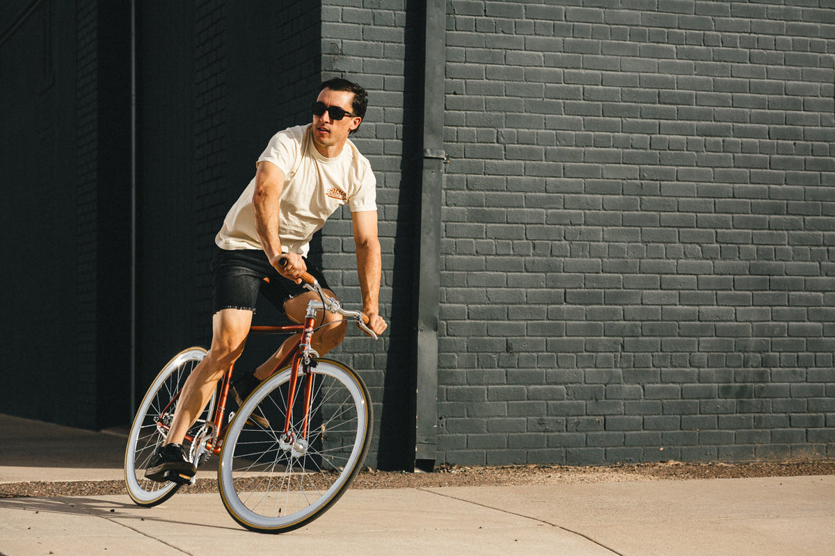State Bicycle Co. Core-Line Lucky Penny copper being ridden, lifestyle shot