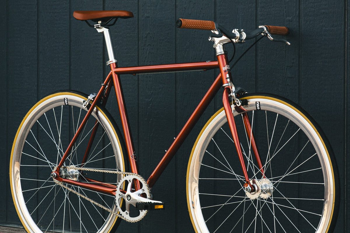 State Bicycle Co. Core-Line Lucky Penny copper, three-quarter lifestyle shot