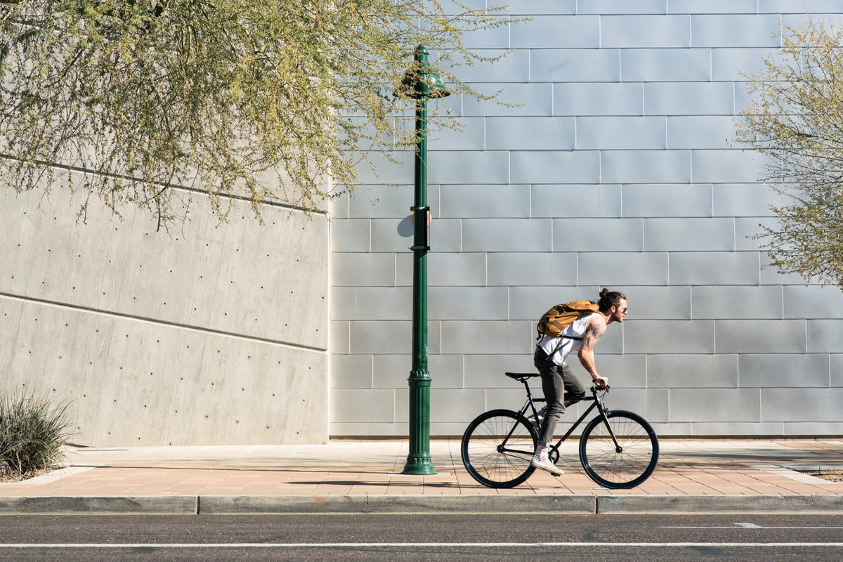 State Bicycle Co. Core-Line Wulf matte black being ridden, lifestyle shot