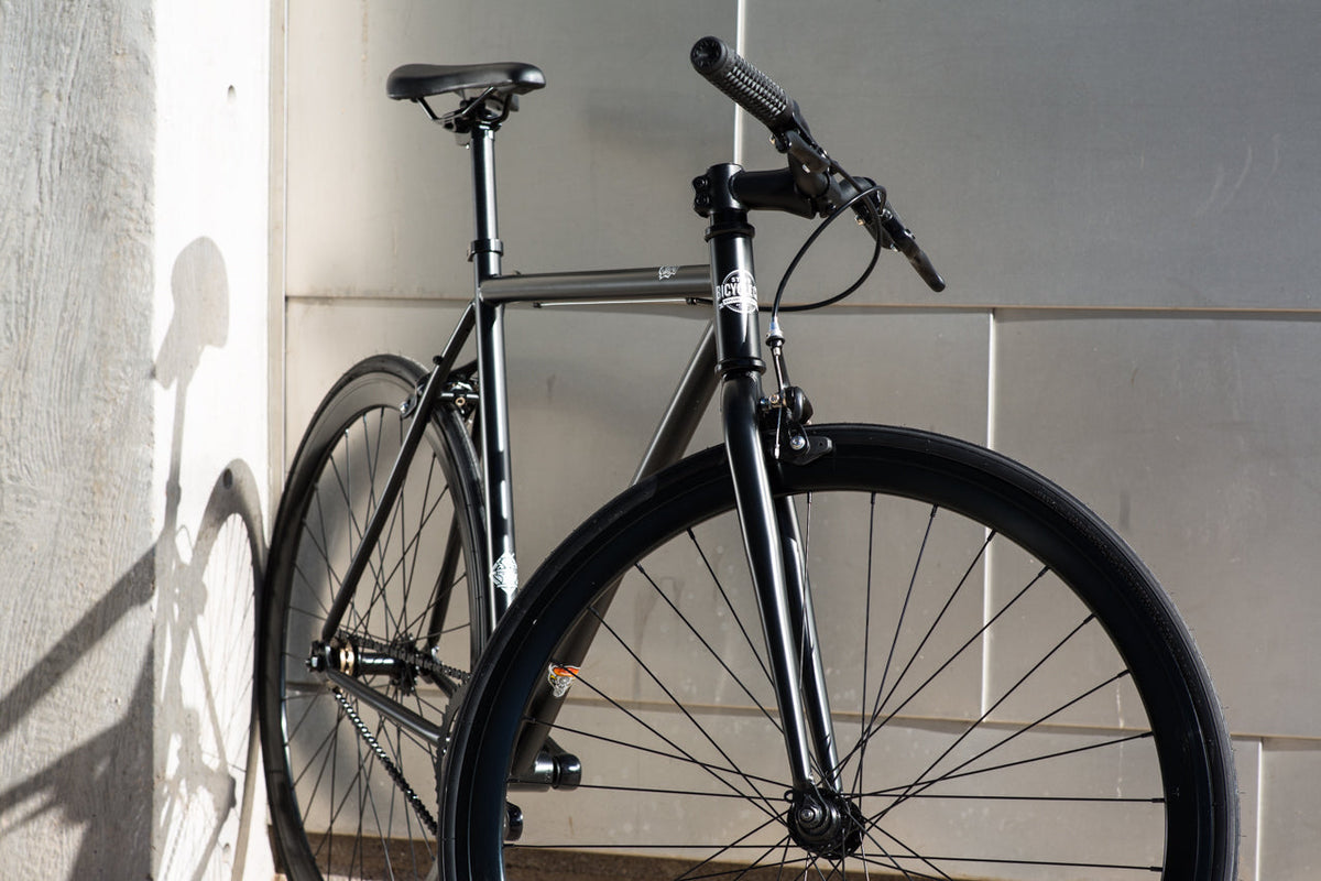 State Bicycle Co. Core-Line Wulf matte black city bike lifestyle shot