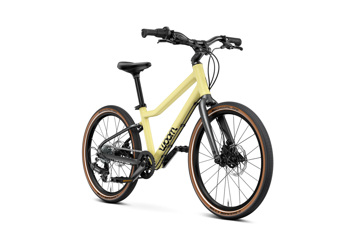 WOOM Explore 4 Mellow Yellow 20-inch kids bike three-quarter view