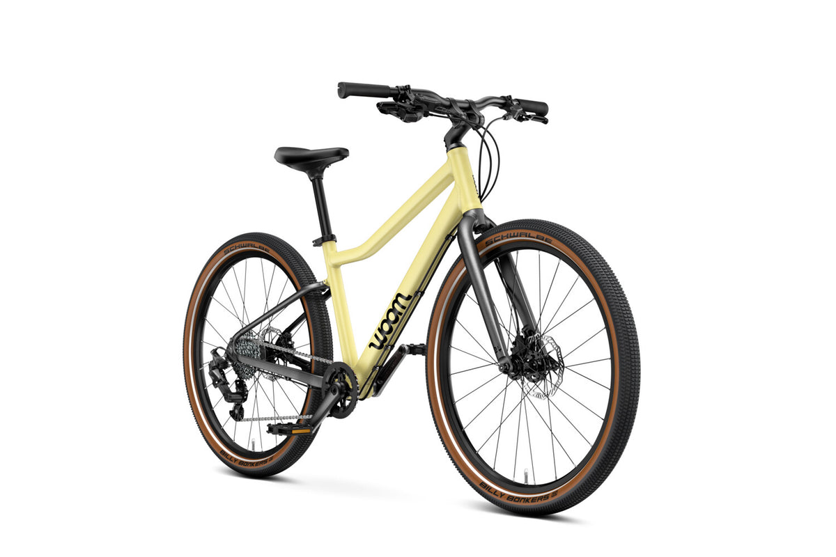 WOOM Explore 5 Mellow Yellow 24-inch kids bike three-quarter view