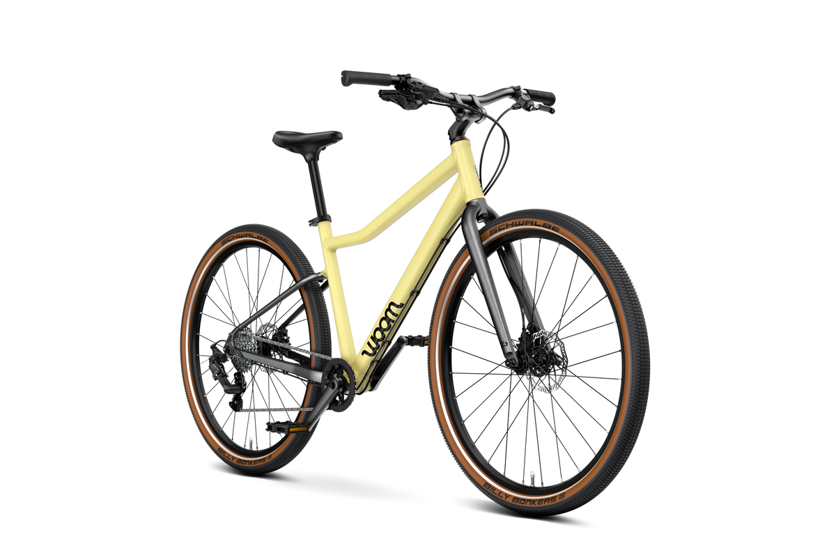 WOOM Explore 6 Mellow Yellow 26-inch kids bike three-quarter view